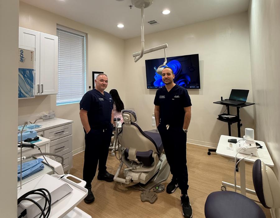 Two McKinney periodontists, doctor Firas Al Yafi and doctor Abdo Ismail standing in the dentistry room.